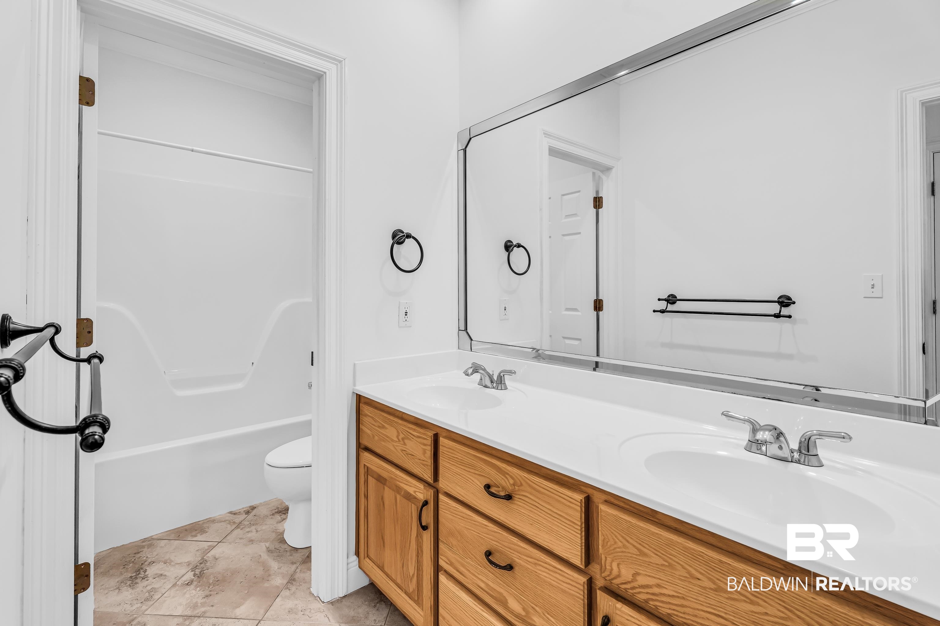 7495 Bromley Road Bay Minette, AL 36507 - Photo 30 of 31 Hall bath has separate room for toilet and shower tub combo