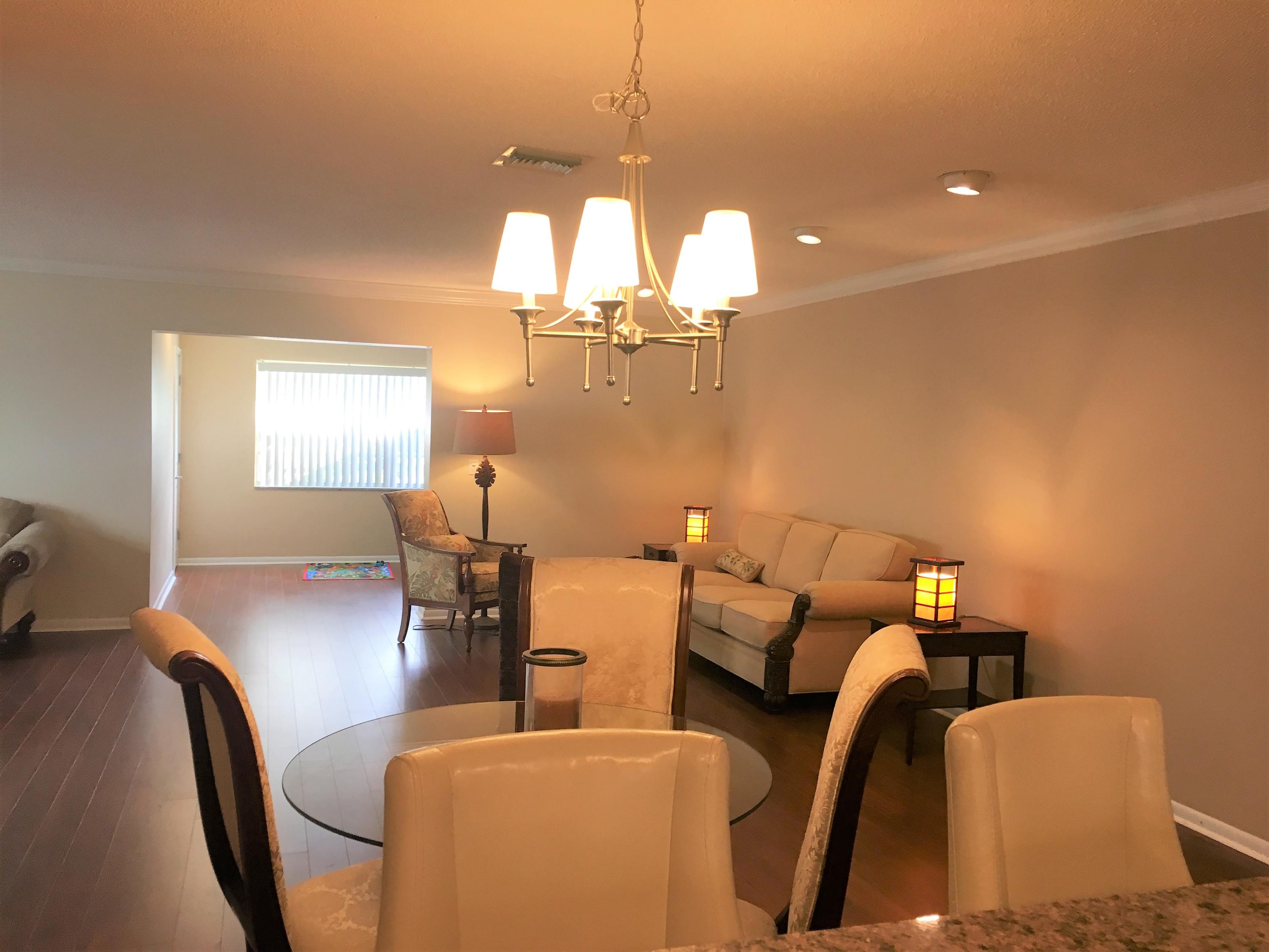 7200 Pine Manor Drive Lake Worth, FL 33467 - Photo 33 of 48 looking out the kitchen window to open l