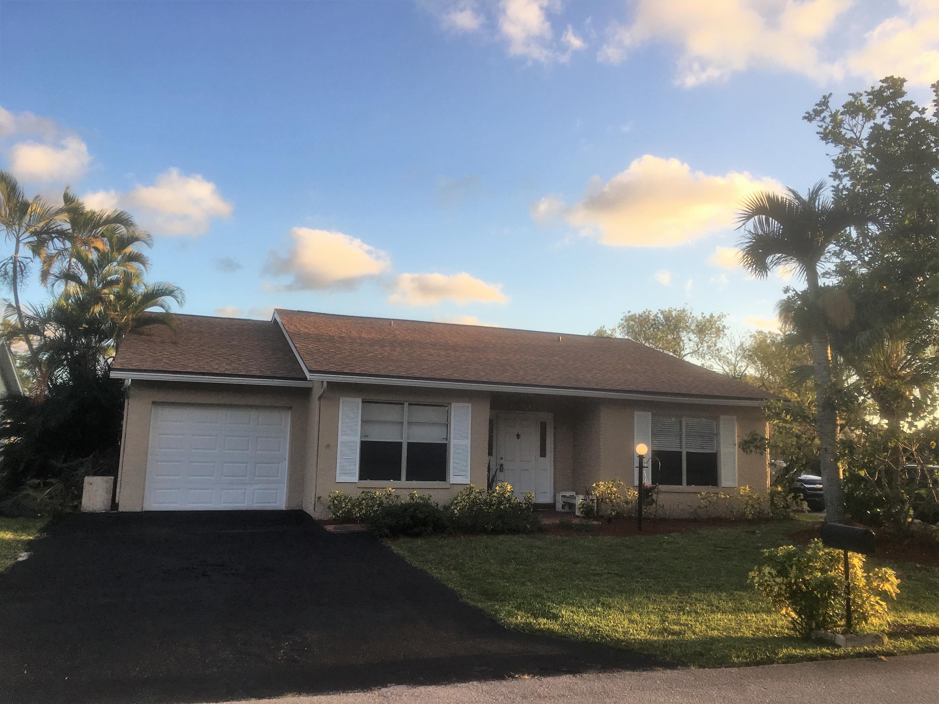 7200 Pine Manor Drive Lake Worth, FL 33467 - Photo 44 of 48 Front of house with 2 car driveway