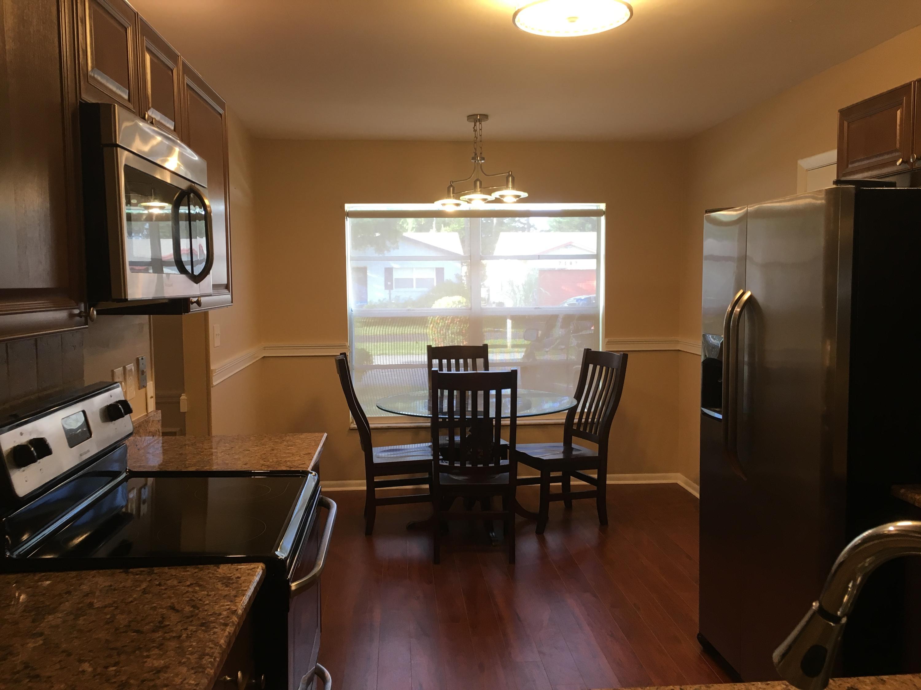 7200 Pine Manor Drive Lake Worth, FL 33467 - Photo 5 of 48 kitchen looking in from counter straight