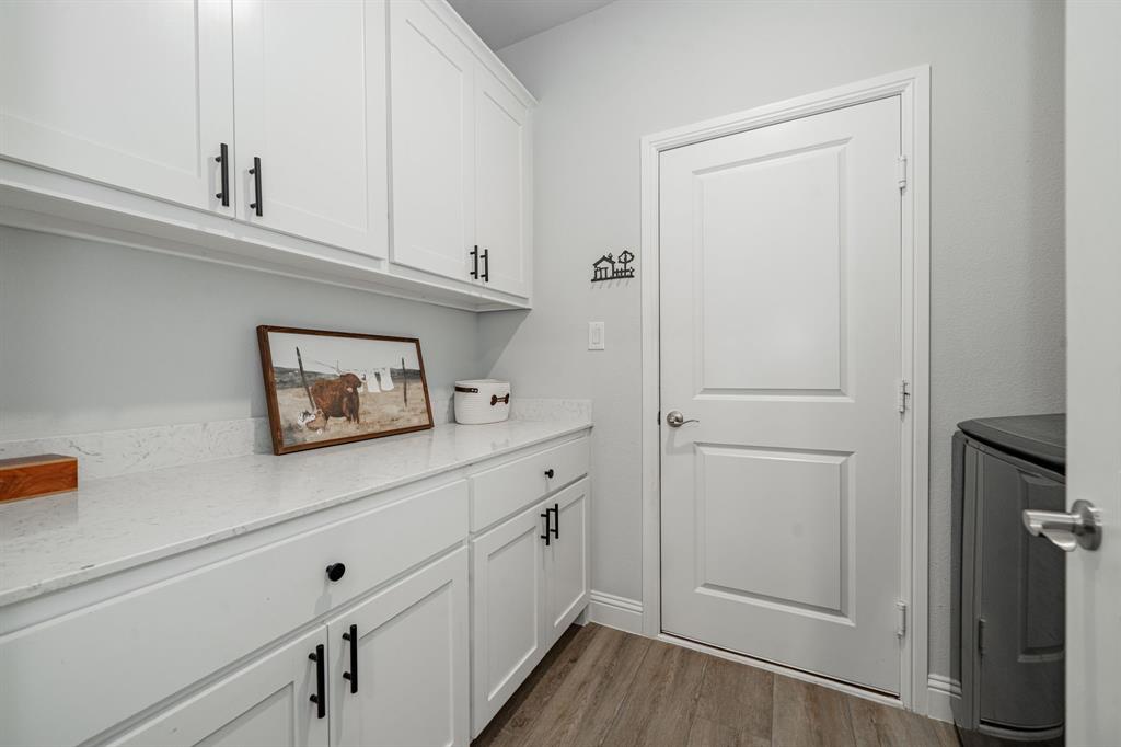 248 Waters Rdg Drive Lavon, TX 75166 - Photo 14 of 36 Laundry room with washer / clothes dryer and dark wood-style flooring