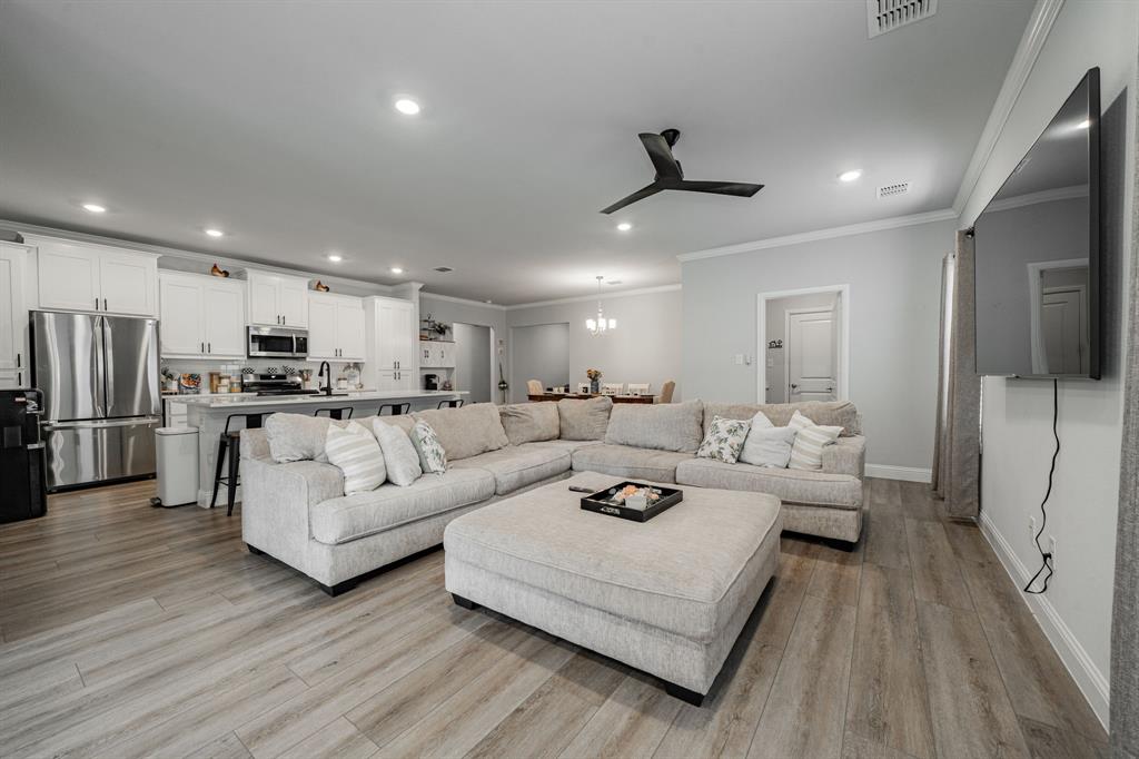 248 Waters Rdg Drive Lavon, TX 75166 - Photo 16 of 36 Living room featuring ornamental molding, recessed lighting, light wood finished floors, and a ceiling fan