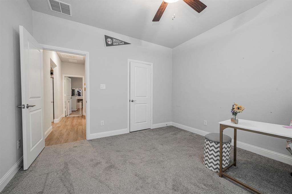248 Waters Rdg Drive Lavon, TX 75166 - Photo 30 of 36 Unfurnished office featuring a ceiling fan, light colored carpet, and lofted ceiling