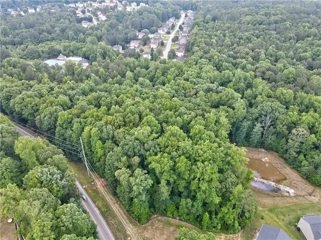 a view of a garden with a house