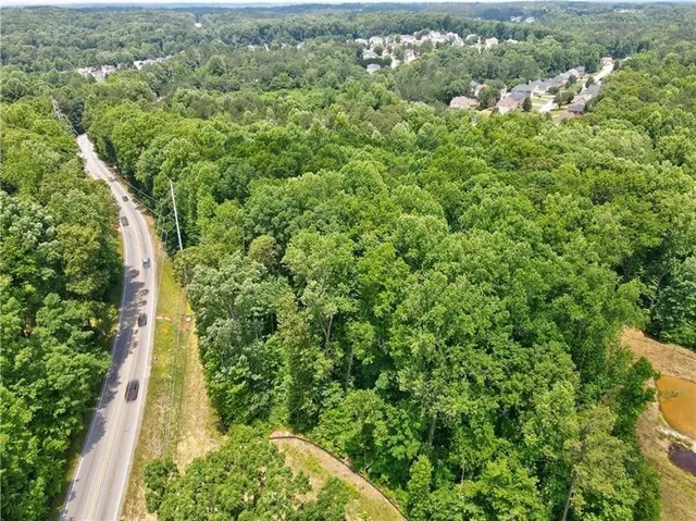 a view of a garden with a building