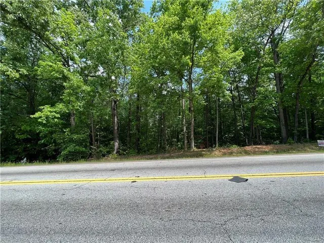 a view of a swimming pool and a yard