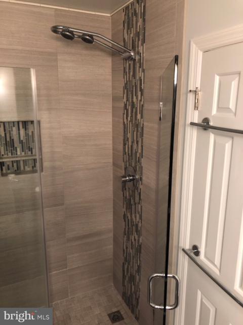 4820 Powell Road Fairfax, VA 22032 - Photo 9 of 31 Double-head shower head and glass tile