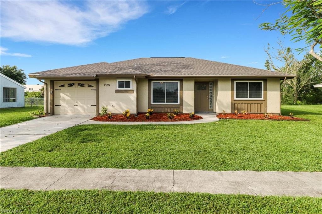a front view of house with yard