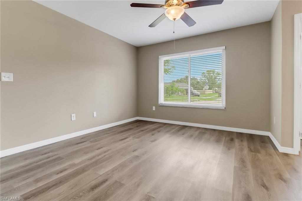 4599 Mongite Road North Port, FL 34287 - Photo 13 of 28 an empty room with a window and a ceiling fan