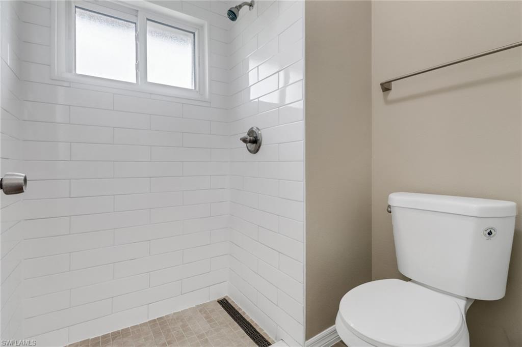 4599 Mongite Road North Port, FL 34287 - Photo 17 of 28 a white toilet sitting next to a shower