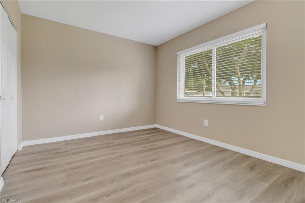4599 Mongite Road North Port, FL 34287 - Photo 18 of 28 a view of an empty room with wooden floor and a window
