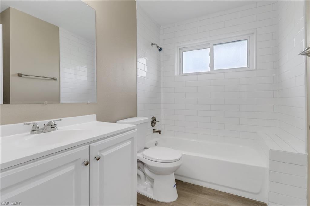 4599 Mongite Road North Port, FL 34287 - Photo 19 of 28 a bathroom with a sink a toilet and a bathtub
