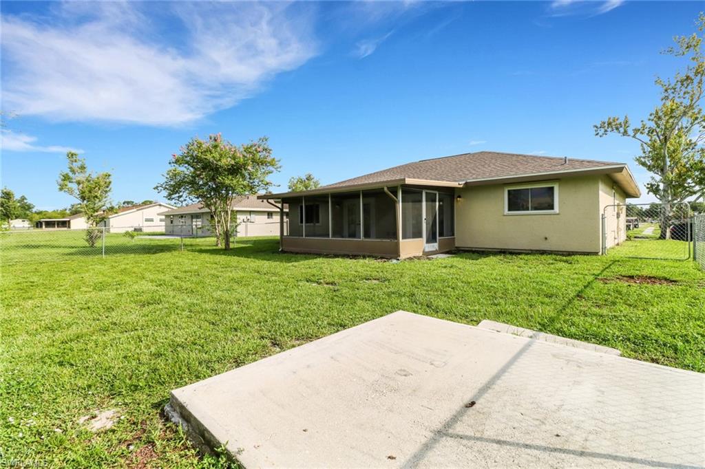 4599 Mongite Road North Port, FL 34287 - Photo 25 of 28 a view of a house with yard and a garden
