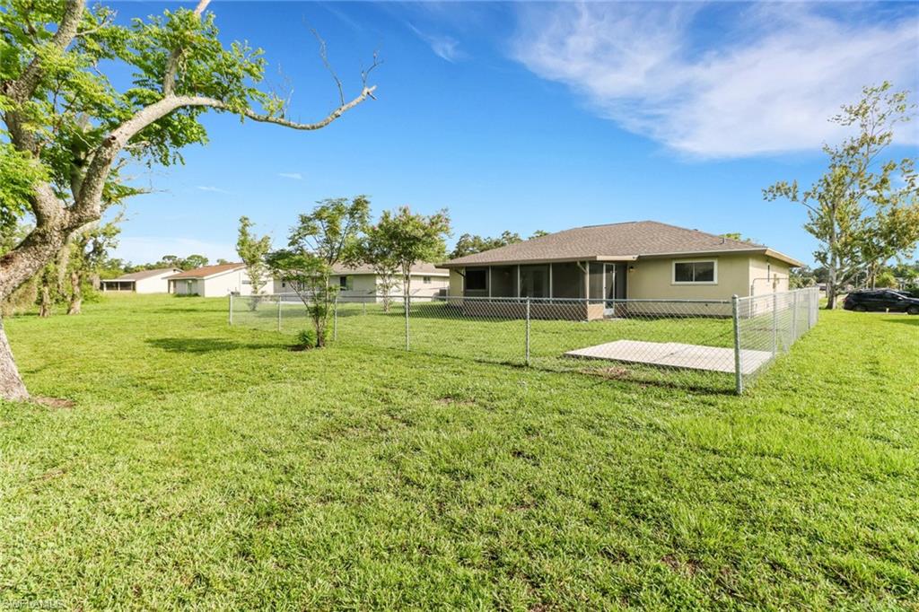 4599 Mongite Road North Port, FL 34287 - Photo 26 of 28 a view of a house with a big yard