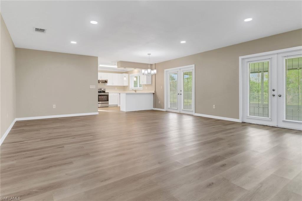 4599 Mongite Road North Port, FL 34287 - Photo 4 of 28 a view of a kitchen with wooden floor