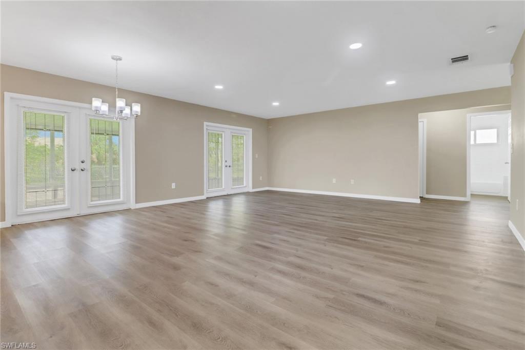 4599 Mongite Road North Port, FL 34287 - Photo 5 of 28 a view of an empty room with wooden floor