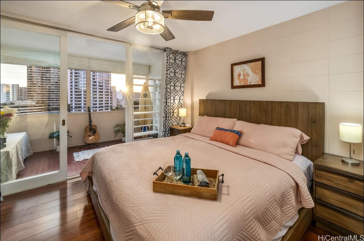 425 Ena Road, Unit 1207B Honolulu, HI 96815 - Photo 1 of 11 a bed sitting in a bedroom and table