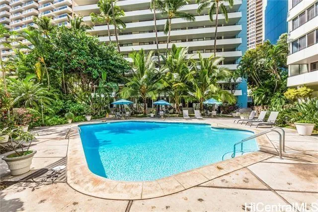 a view of a swimming pool with sitting area