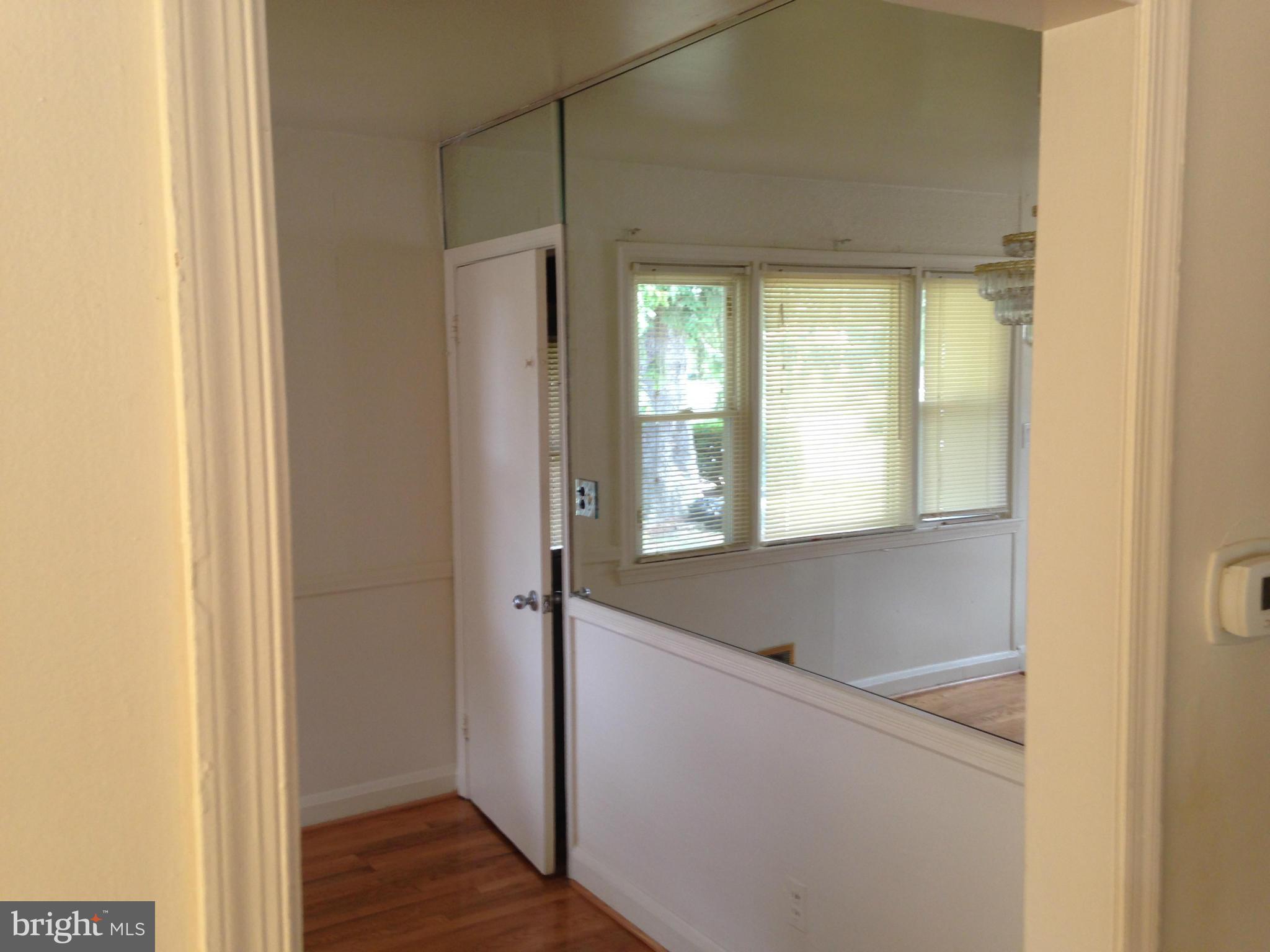 6724 Campfield Road Baltimore, MD 21207 - Photo 5 of 6 a view of hallway with wooden floor
