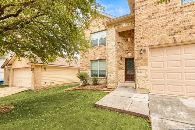 a backyard of a house with seating space