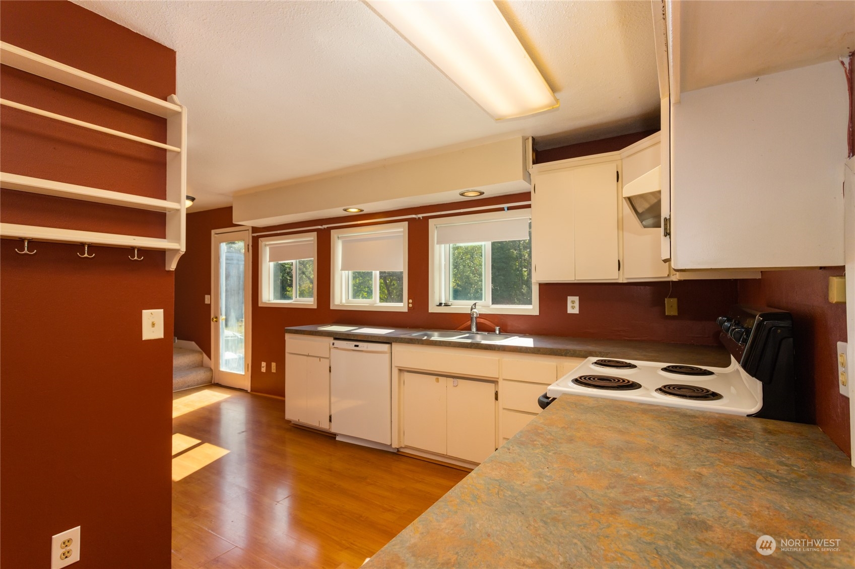 1187 West Axton Road Ferndale, WA 98248 - Photo 13 of 40 a kitchen with a sink a stove and cabinets