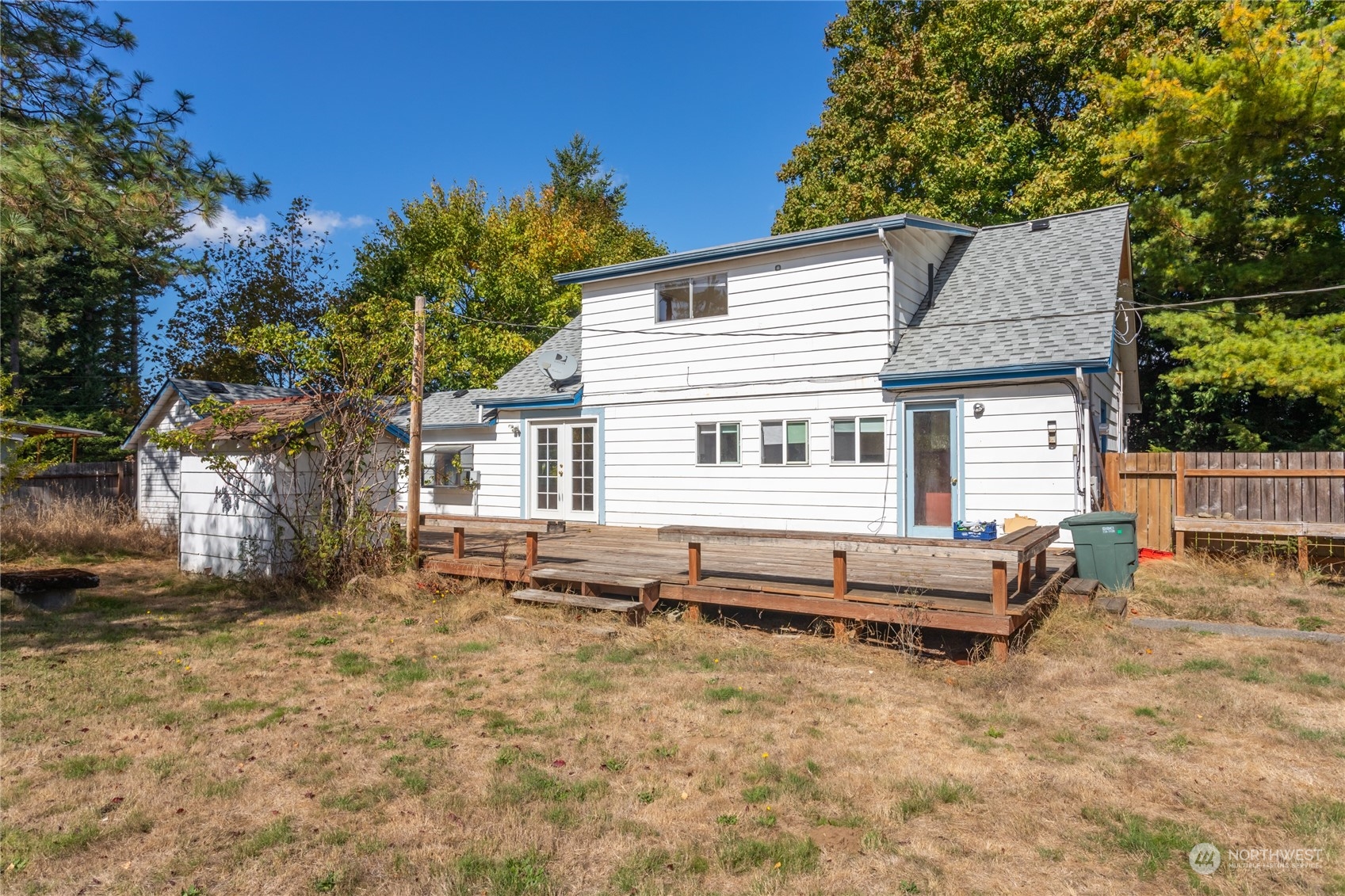 1187 West Axton Road Ferndale, WA 98248 - Photo 39 of 40 a backyard of a house with barbeque oven table and chairs