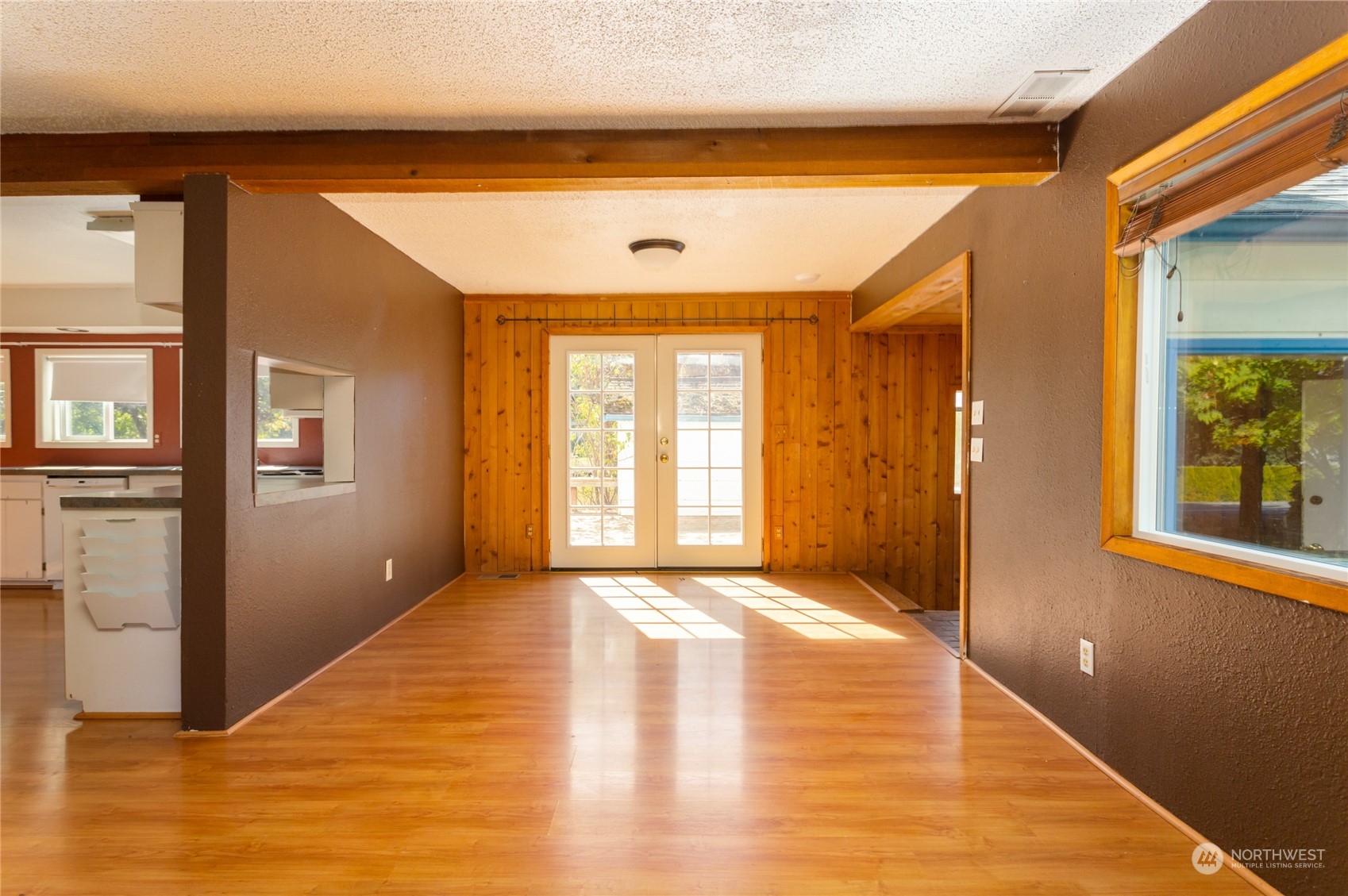 1187 West Axton Road Ferndale, WA 98248 - Photo 6 of 40 a view of an empty room with wooden floor and a window