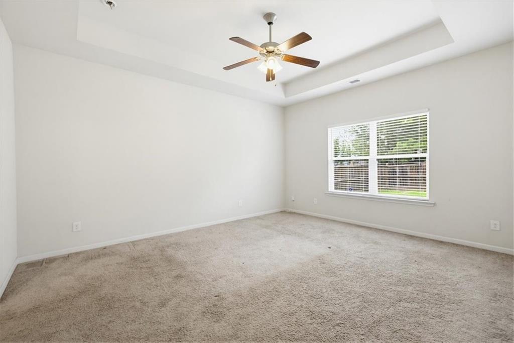 314 Boulder Run Hiram, GA 30141 - Photo 16 of 31 an empty room with a window and a ceiling fan