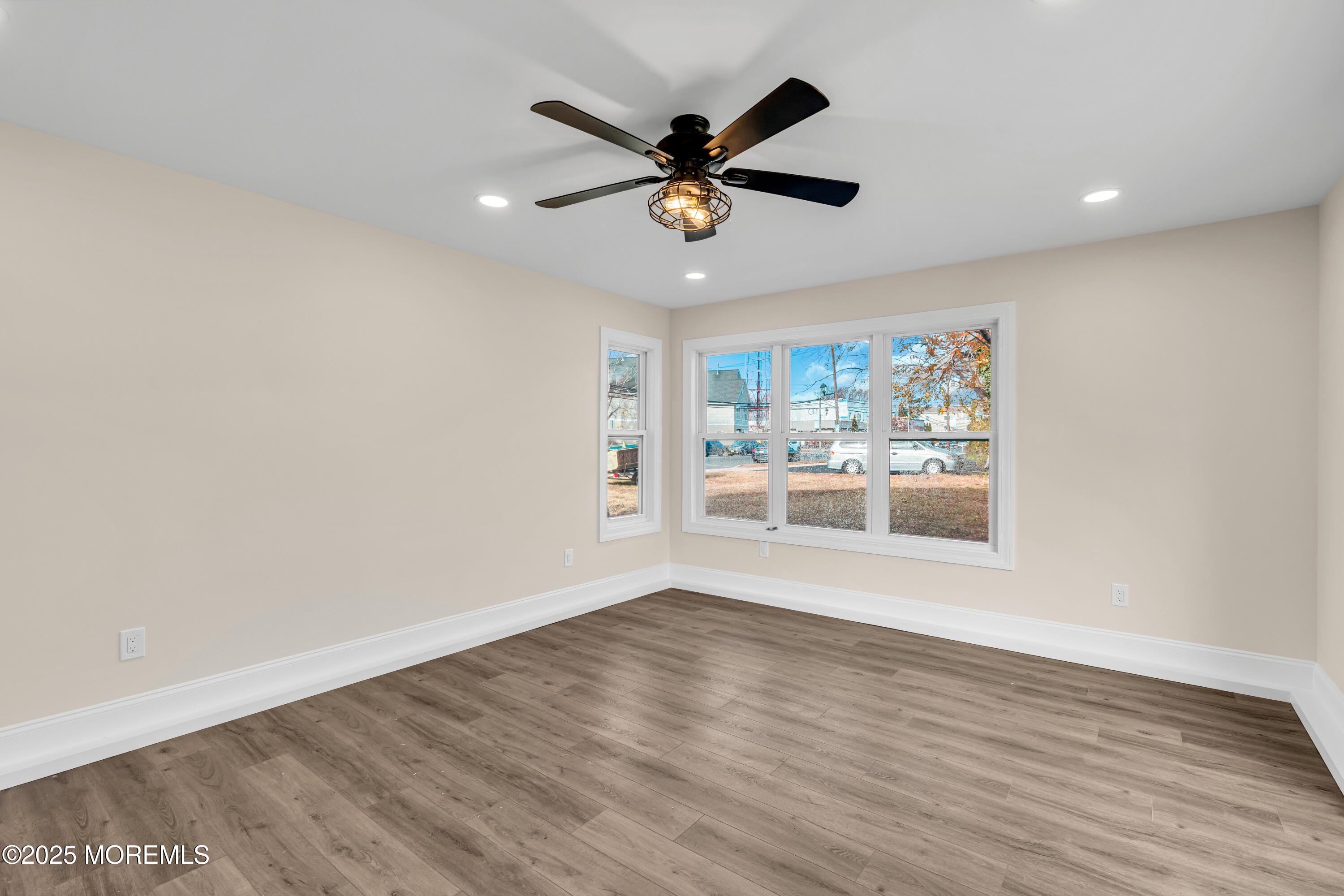 1900 Main Street Belmar, NJ 07719 - Photo 18 of 20 a view of a livingroom with a ceiling fan and wooden floor
