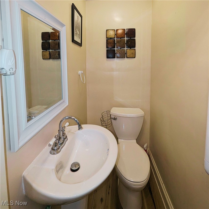557 Cambridge Road Coshocton, OH 43812 - Photo 13 of 20 Half-bathroom perfect for guests and convenience.
