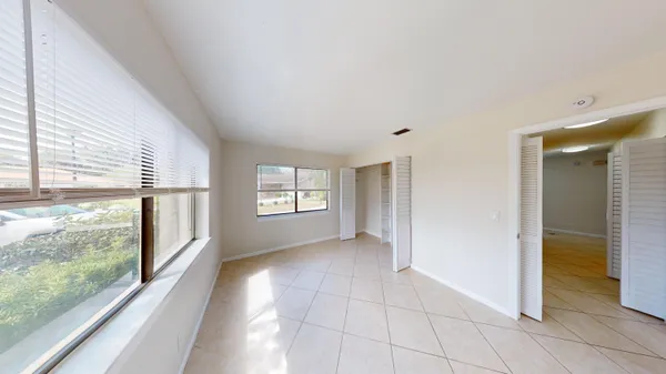 a view of hallway with windows