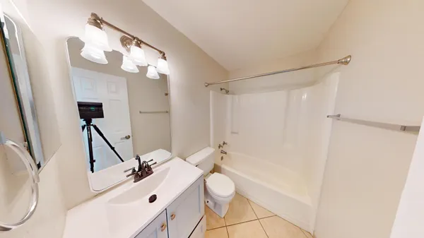 a bathroom with a sink a mirror and a shower