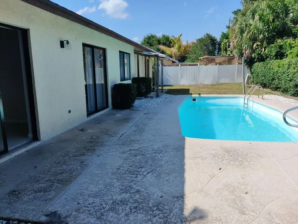 a view of table and chairs in the patio