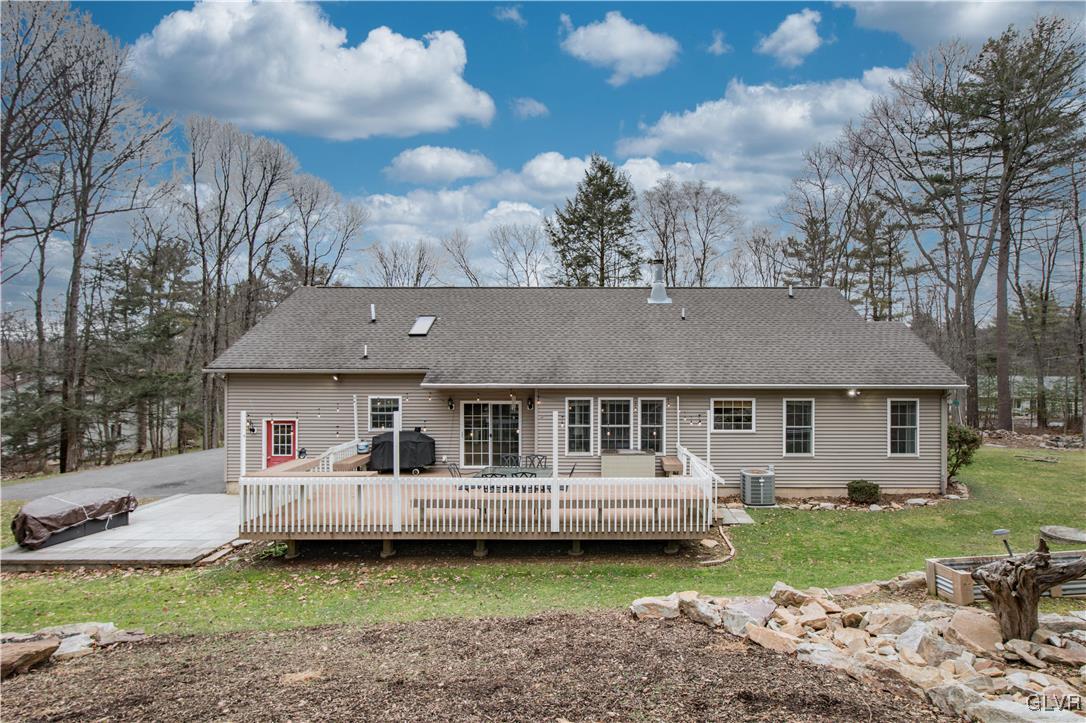 2431 Point Phillips Road Kunkletown, PA 18058 - Photo 54 of 67 a front view of a house with a garden and trees