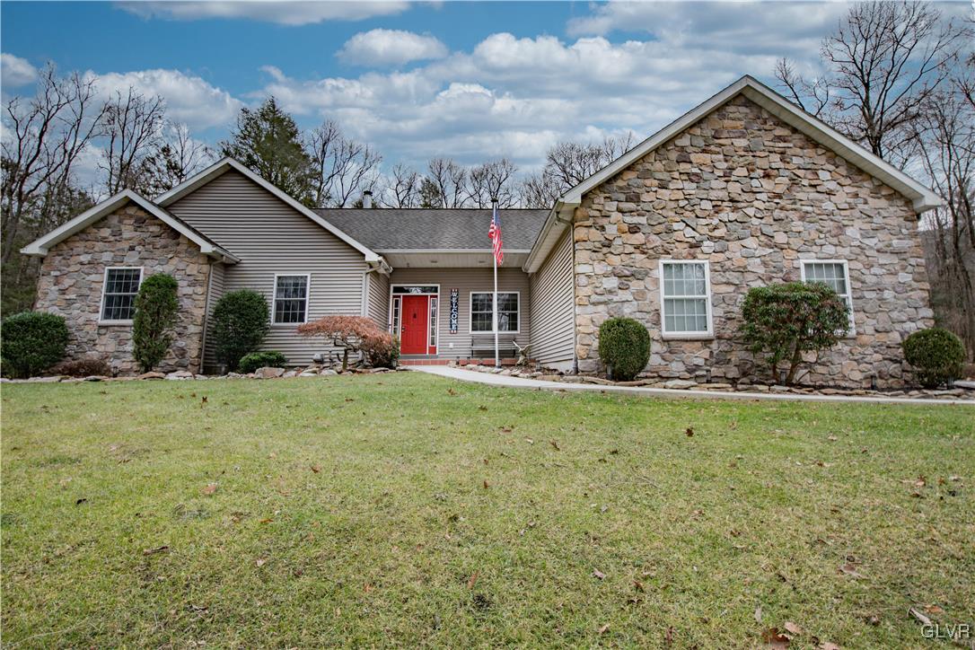 2431 Point Phillips Road Kunkletown, PA 18058 - Photo 67 of 67 a view of a house with big yard and potted plants