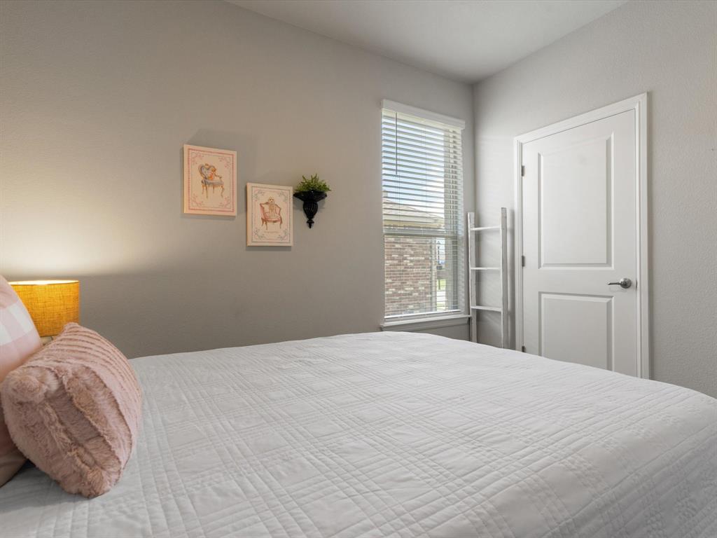 270 Lunayena Road Rhome, TX 76078 - Photo 7 of 37 The guest bedroom offers a comfortable and versatile space with natural light and a closet, making it ideal for family, overnight guests, or a home office to fit your lifestyle.