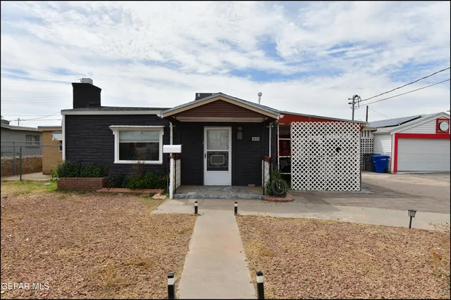 front view of a house with a rug