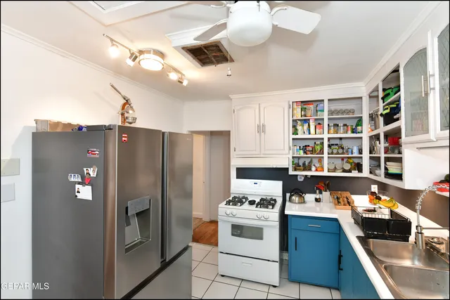 a bathroom with a sink a mirror and a shower