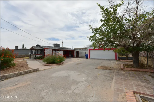 a view of a house with a street