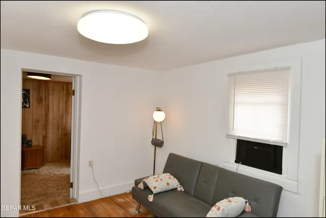 a view of a livingroom with furniture and a window