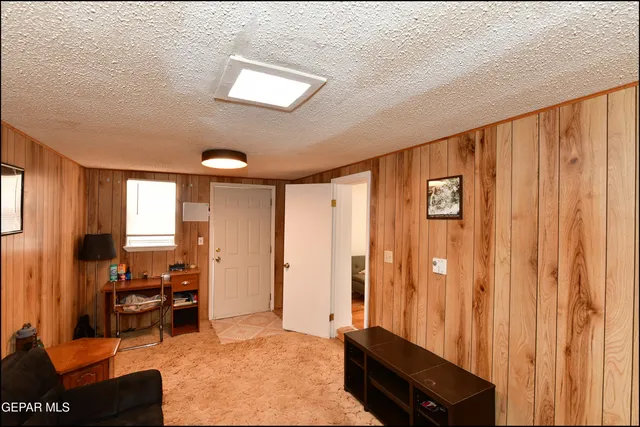 a view of a livingroom with furniture and a table