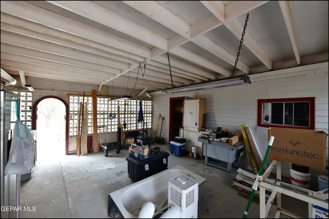 a living room with lots of furniture and a table