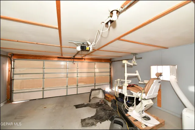 a view of a patio with table and chairs and wooden floor