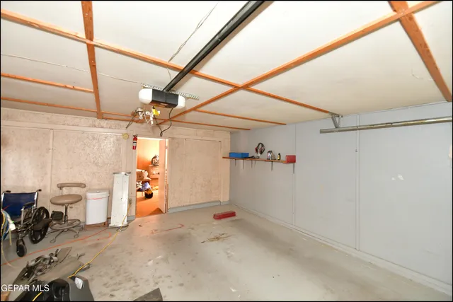 a view of a dry yard with trees