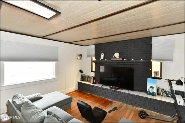 a bedroom with furniture and a fireplace