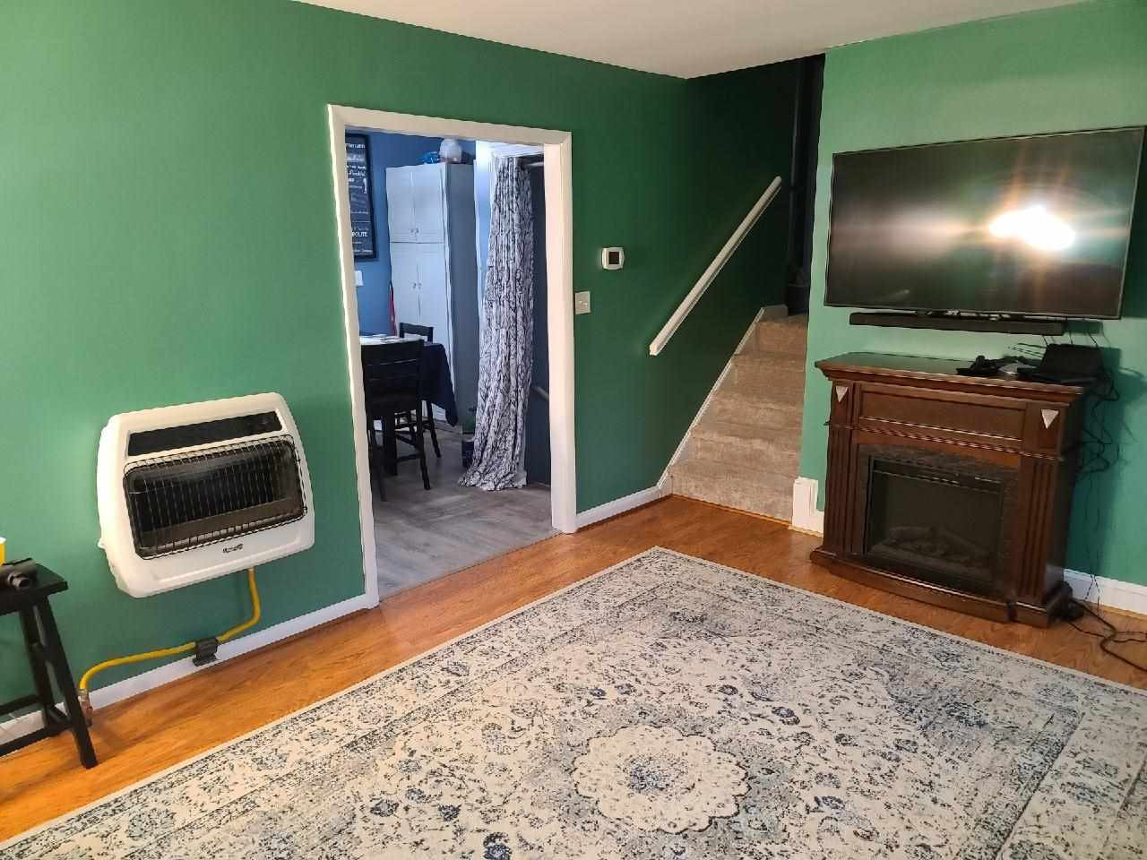 7010 Sorrell Lane Raleigh, NC 27603 - Photo 3 of 29 Living Room is located on the Main level of the home. It has a Gas Wall Heater, However the home has a fully functional Heat Pump System. This is just an alternative source of heat. Living Room