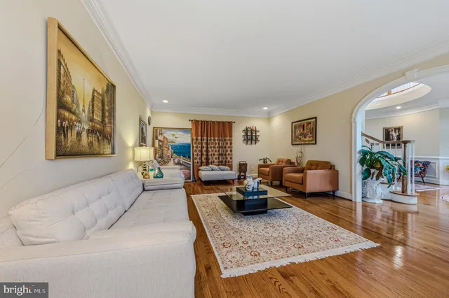 a living room with fireplace furniture and a flat screen tv
