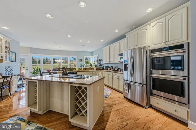 a living room with furniture a flat screen tv and a table