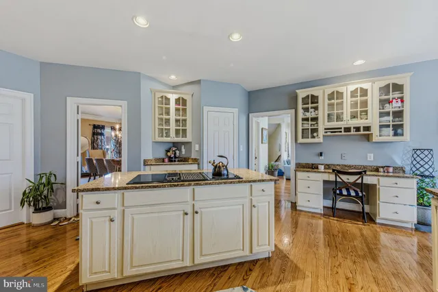 a bathroom with a sink toilet and a mirror