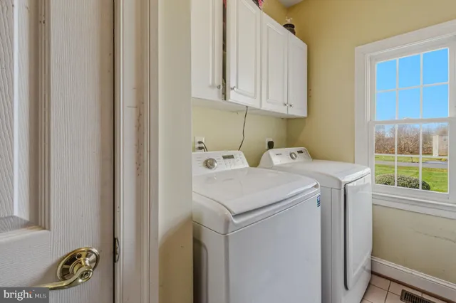 a en suite bathroom with a double vanity sink and a mirror